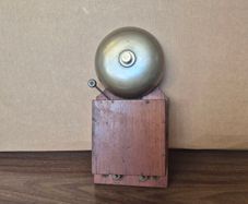 vintage wood-cased block bell or electric alarm bell