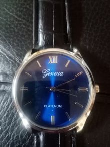 Nice New man's watch. Blue face. Black strap.