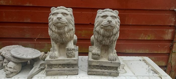 handcrafted concrete lions