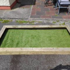 wooden graveside surrounding with astro