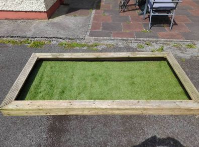 wooden graveside surrounding with astro