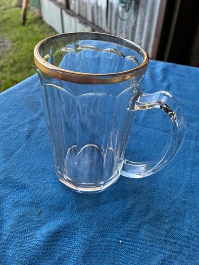 Vintage pint glass in leather holder