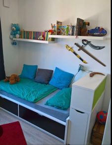 Ikea Flaxa bed with storage headboard.