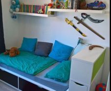 Ikea Flaxa bed with storage headboard.