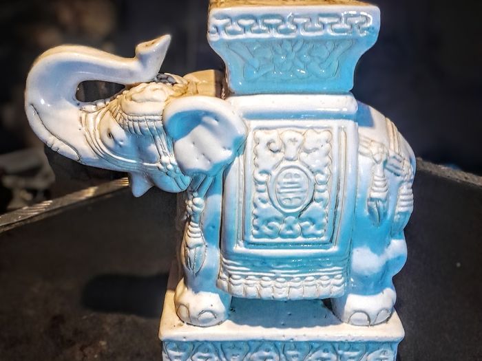 White ceramic elephant stand
