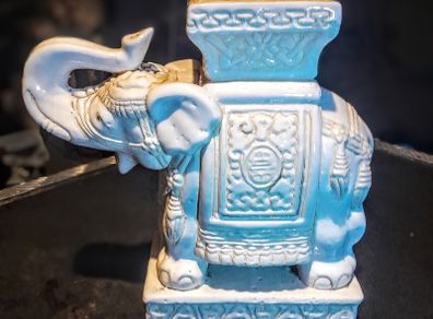 White ceramic elephant stand