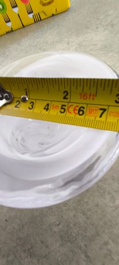 A Small Kosta Boda Art Glass Bowl with White Swirl Detail