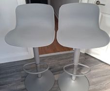 Two adjustable grey breakfast bar stools