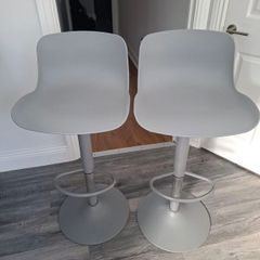 Two adjustable grey breakfast bar stools