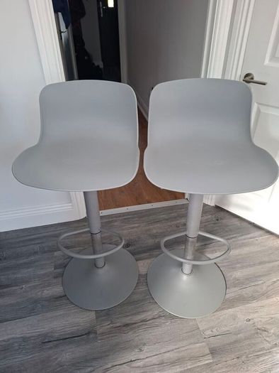 Two adjustable grey breakfast bar stools