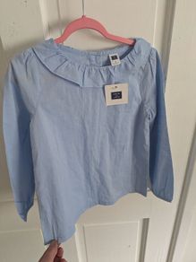 Blue top with tags