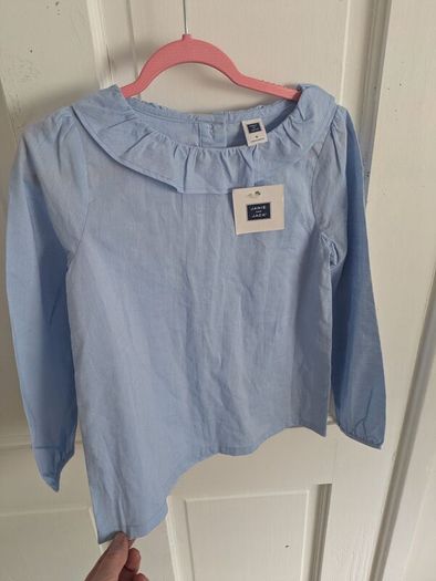 Blue top with tags