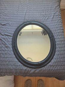 black oval mirror