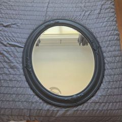 black oval mirror