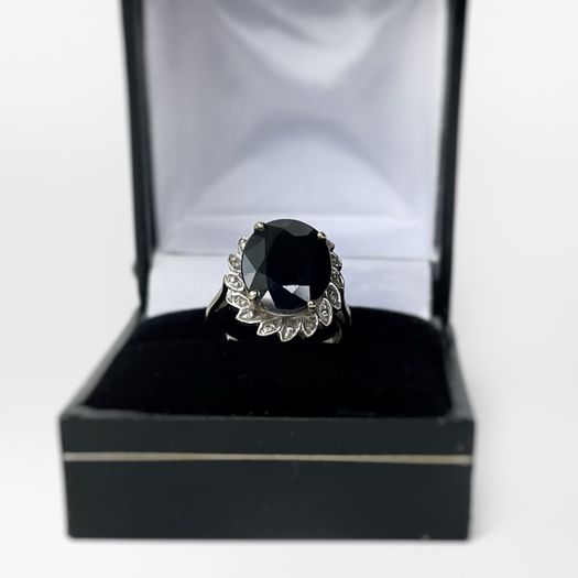 9ct Gold ring with a large sapphire and diamonds