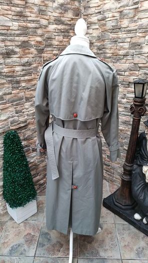 Vintage Nuage ladies trenchcoat Approximately late 90s early 00s Size 10 on label The colour is a pale bluey grey with brown buttons It's got an inner lining that can be removed