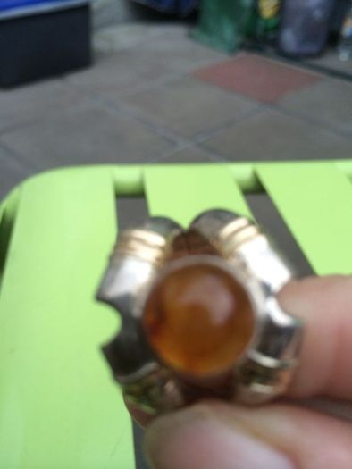 A lovely silver and gold ring with Amber stone