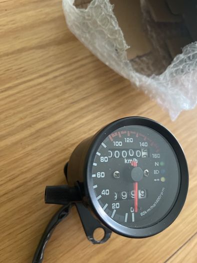 speedo clock brand new has mounting bracket and never fitted