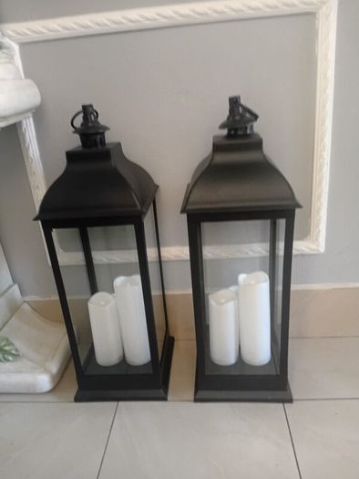Floor lanterns standing 27 ins high and 21 ins width