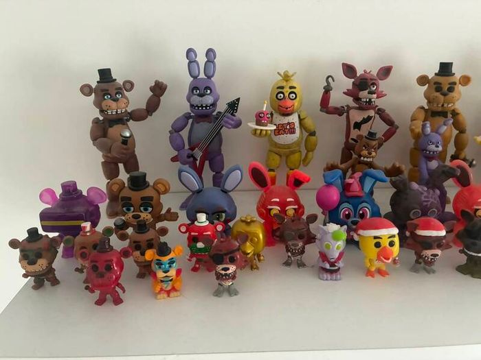 Five Nights at Freddys plushies and dragon figures