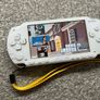 Modded Sony White PSP 1000 with Over 100 Games with Case and Charger. Image 2