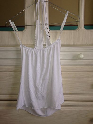 White top with pattern on it