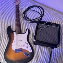 squire by fender debut Stratocaster in 2 tone sun burst with fender amp