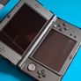 New 3DS XL Metallic Black with Games & Case Image 5