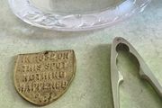 3 different items. No. 1- Vintage Brass Motto Plaque / Shield. In Great Condition. 38.00 euro. 2- KitchenCraft Chrome Nut Cracke 12.00 euro. 3- Vintage Marquis By Waterford Iris Crystal Oval is  Picture Frame but missing the back could uesd as trinklet di