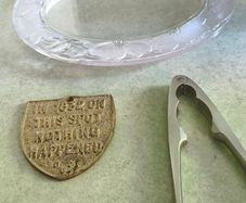 3 different items. No. 1- Vintage Brass Motto Plaque / Shield. In Great Condition. 38.00 euro. 2- KitchenCraft Chrome Nut Cracke 12.00 euro. 3- Vintage Marquis By Waterford Iris Crystal Oval is  Picture Frame but missing the back could uesd as trinklet di
