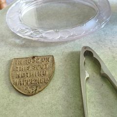 3 different items. No. 1- Vintage Brass Motto Plaque / Shield. In Great Condition. 38.00 euro. 2- KitchenCraft Chrome Nut Cracke 12.00 euro. 3- Vintage Marquis By Waterford Iris Crystal Oval is  Picture Frame but missing the back could uesd as trinklet di