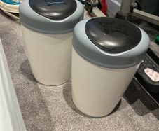 Two Tommy tippee nappy bins