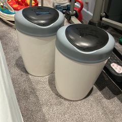 Two Tommy tippee nappy bins