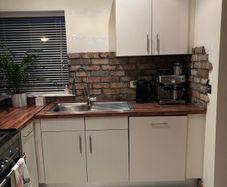 Fitted kitchen. Light cream high gloss kitchen