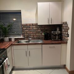 Fitted kitchen. Light cream high gloss kitchen