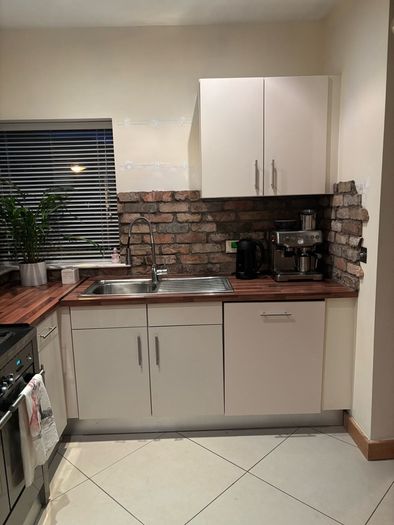Fitted kitchen. Light cream high gloss kitchen