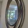 Contemporary circular wall mirror - black and silver finish Image 3