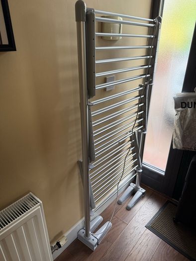 Heated clothes drying rack