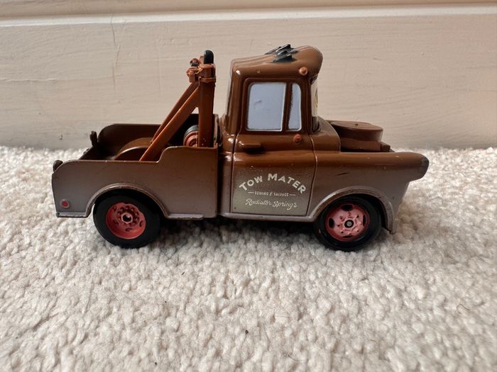 Disney Pixar Cars Radiator Springs Tow Mater Truck Diecast Metal Vehicle approx. 9.5 cm. length one of the back wheels is not working usad Please see photos