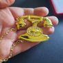 Gold Tone Rotary Telephone Brooch with Chain | 80s 90s Style Novelty Kitsch Jewelry | Old Fashioned Phone Pin Badge Image 4