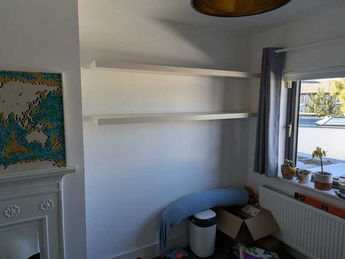 Two white floating shelves