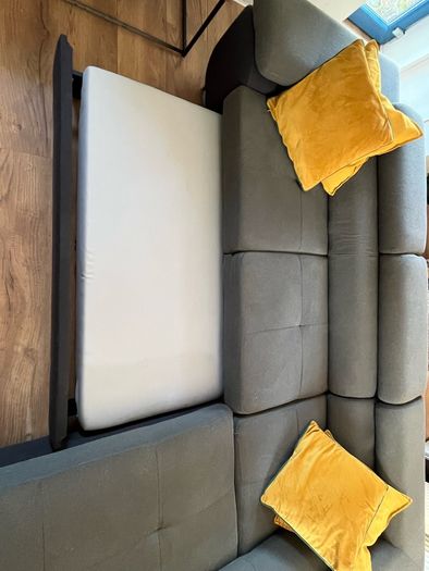 Sofa bed with reclining headrests