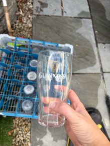 Guinness pint glass with crate