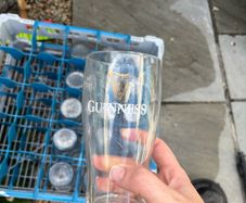 Guinness pint glass with crate