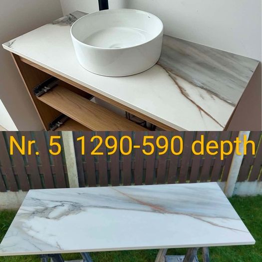Stone countertops backsplashs window cills.