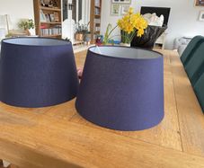 Two large navy lampshades
