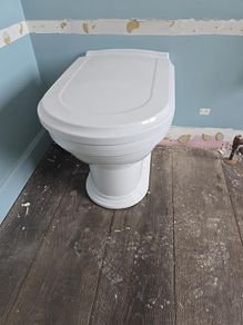 4 traditional style white ceramic toilets available for sale.