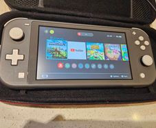 Nintendo Switch Lite + Case, charger, 2x games
