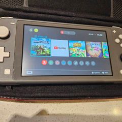 Nintendo Switch Lite + Case, charger, 2x games