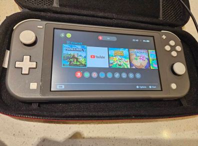 Nintendo Switch Lite + Case, charger, 2x games